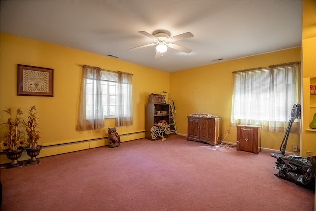 miscellaneous room with ceiling fan, carpet floors, and a baseboard heating unit