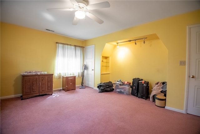 miscellaneous room with ceiling fan and dark carpet