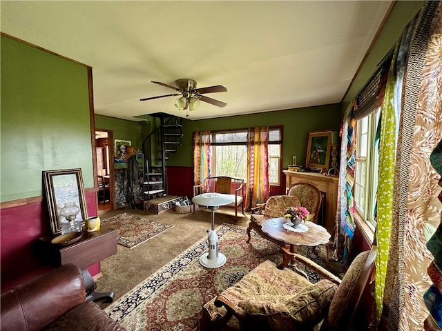 living room featuring ceiling fan and carpet floors