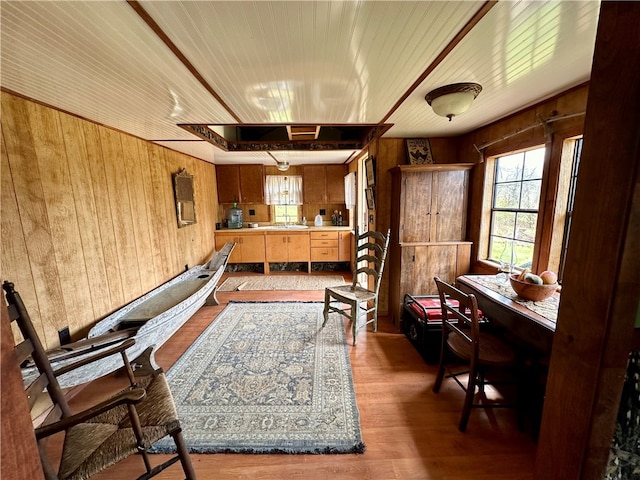 interior space featuring dark hardwood / wood-style flooring, wood ceiling, and wooden walls