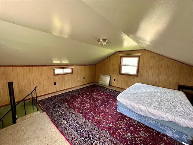 bedroom with carpet flooring and vaulted ceiling