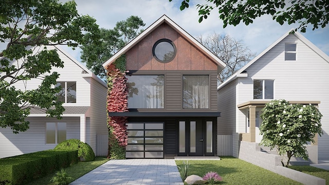 view of front facade with a front lawn and a garage