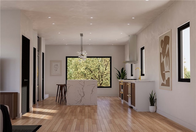 dining room featuring a chandelier, light hardwood / wood-style floors, and a wealth of natural light