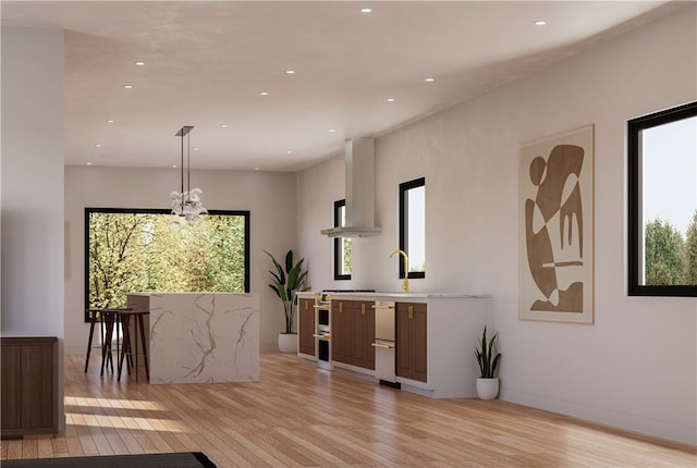 dining area featuring a chandelier and light wood-type flooring