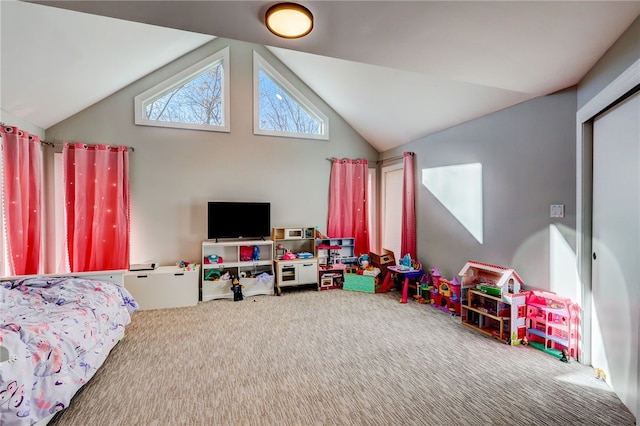 bedroom featuring carpet floors and vaulted ceiling