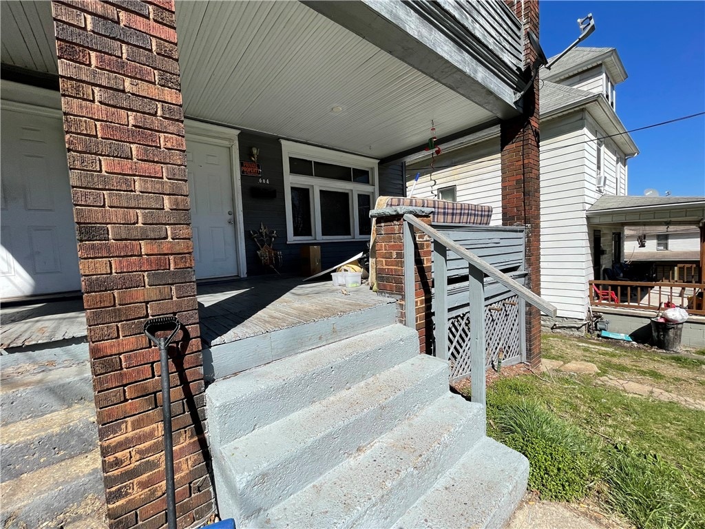 doorway to property featuring a porch