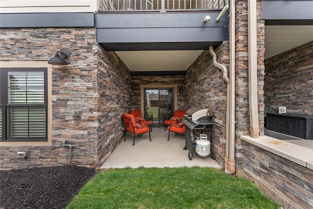 entrance to property with a balcony