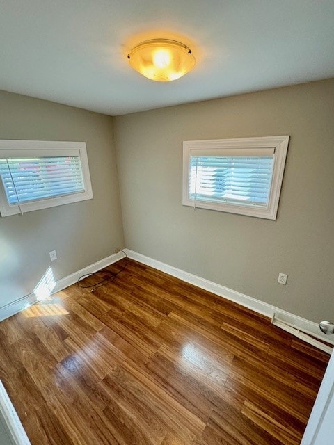 spare room featuring hardwood / wood-style floors