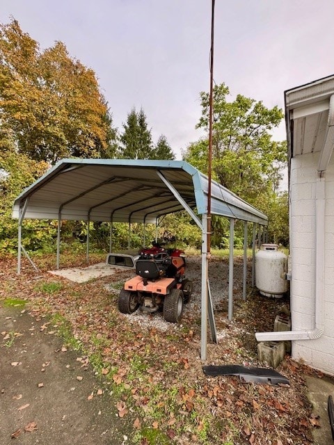 view of parking / parking lot featuring a carport