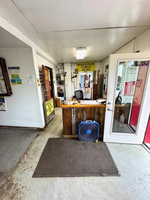 interior space featuring concrete flooring