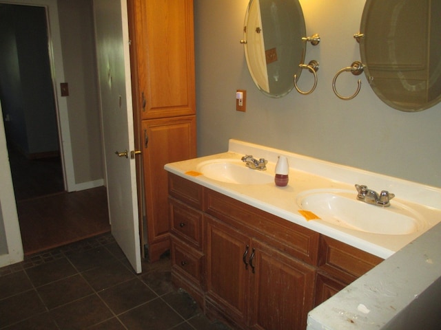 bathroom featuring double vanity and tile floors