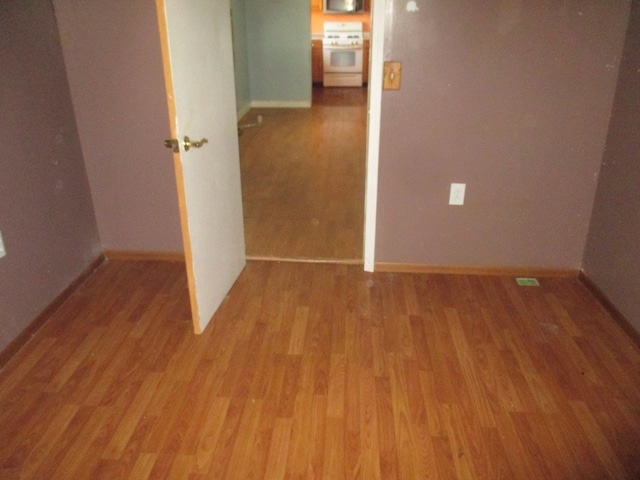 spare room with light hardwood / wood-style flooring