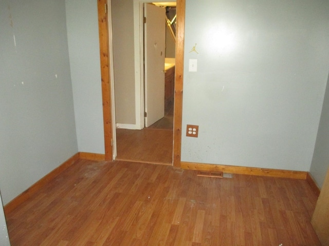 unfurnished room with light hardwood / wood-style flooring