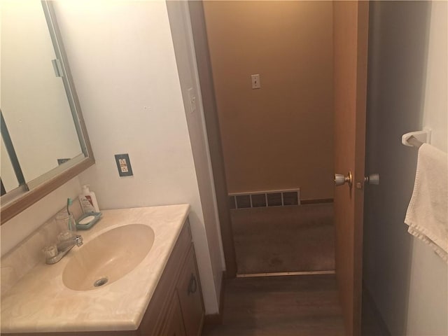 bathroom with visible vents and vanity