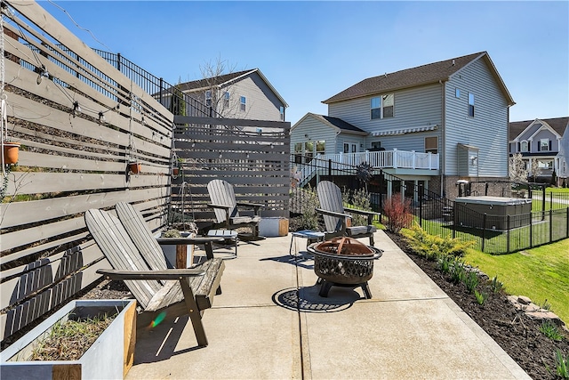 view of terrace with an outdoor fire pit