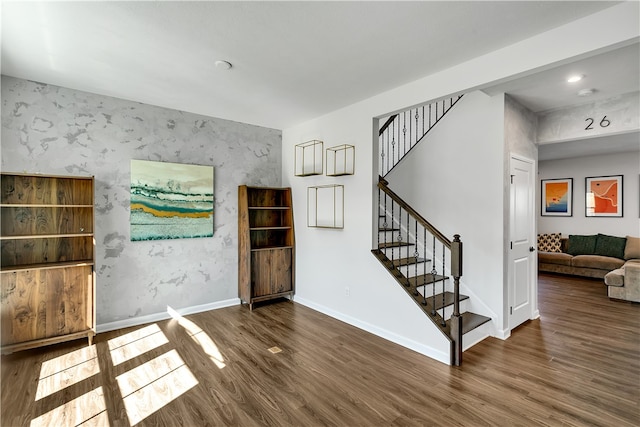 unfurnished room with dark hardwood / wood-style floors