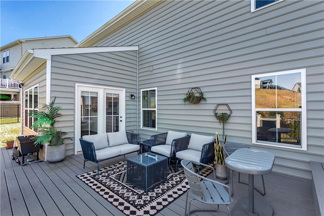 deck featuring outdoor lounge area