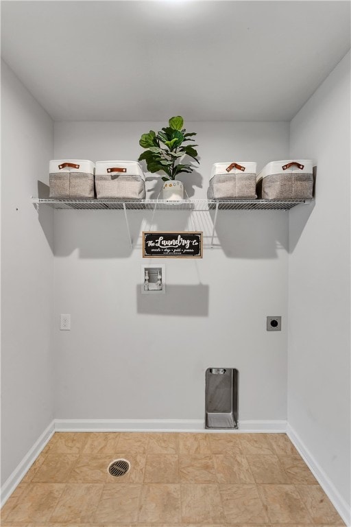 laundry area featuring hookup for a washing machine, hookup for an electric dryer, and light tile flooring