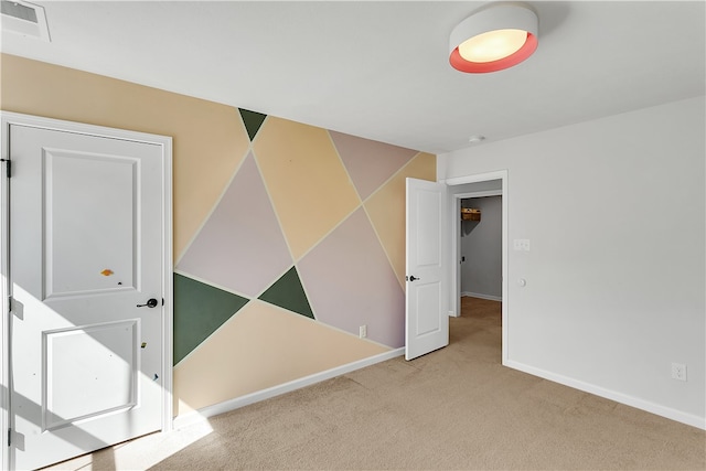 empty room featuring light colored carpet