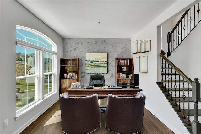 interior space featuring a healthy amount of sunlight and dark hardwood / wood-style flooring