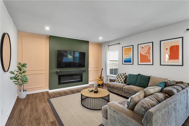 living room with dark hardwood / wood-style flooring