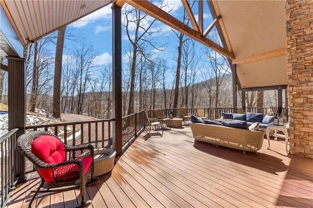 snow covered deck featuring an outdoor hangout area