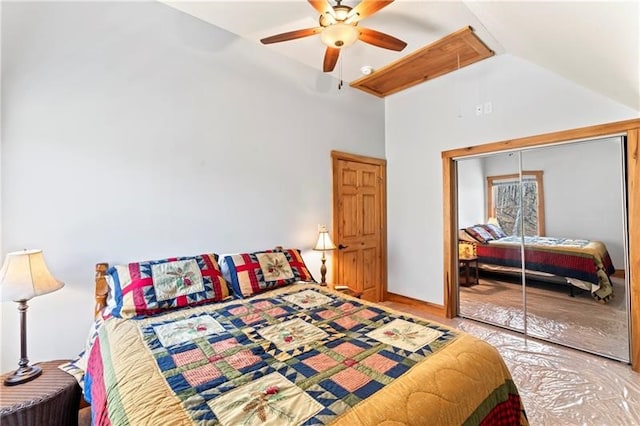 bedroom with ceiling fan, high vaulted ceiling, and a closet