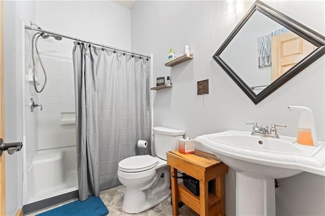 bathroom with tile flooring, shower / bath combo with shower curtain, and toilet