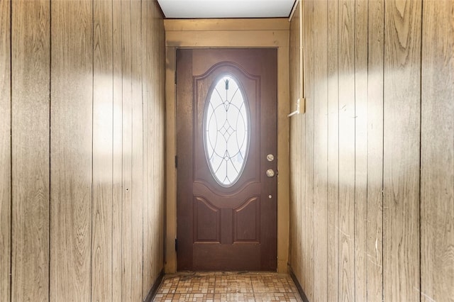 doorway to outside with light tile floors