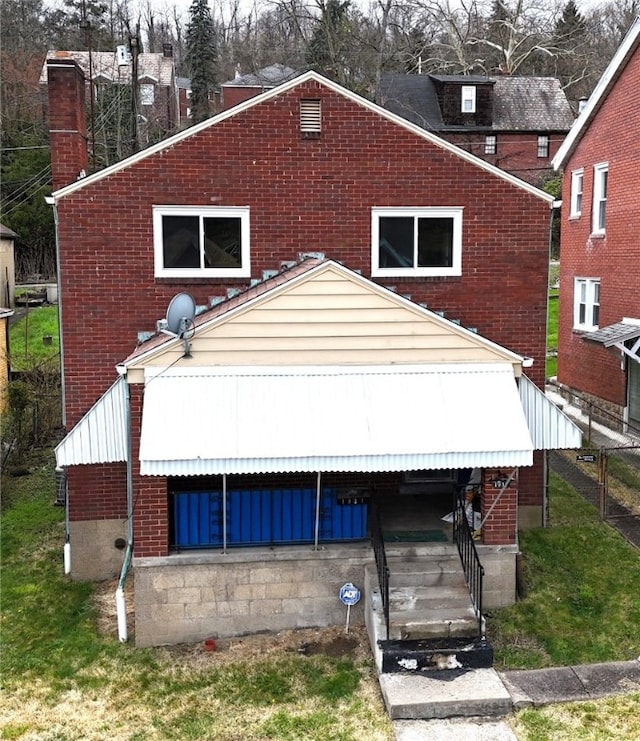 view of front of house with brick siding