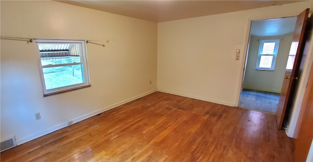 empty room featuring wood-type flooring