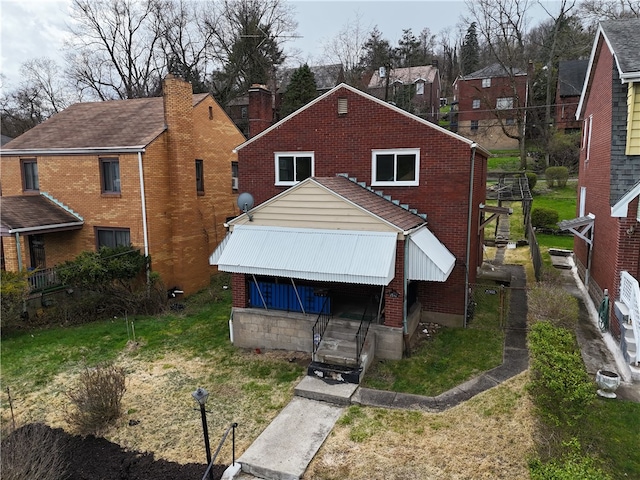 back of property featuring a wooden deck