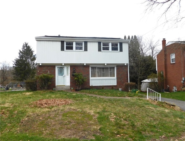 front facade with a front yard