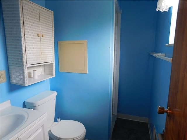 bathroom with toilet and vanity