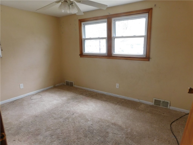 carpeted empty room with ceiling fan