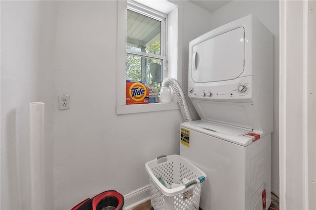 laundry room with stacked washer and clothes dryer