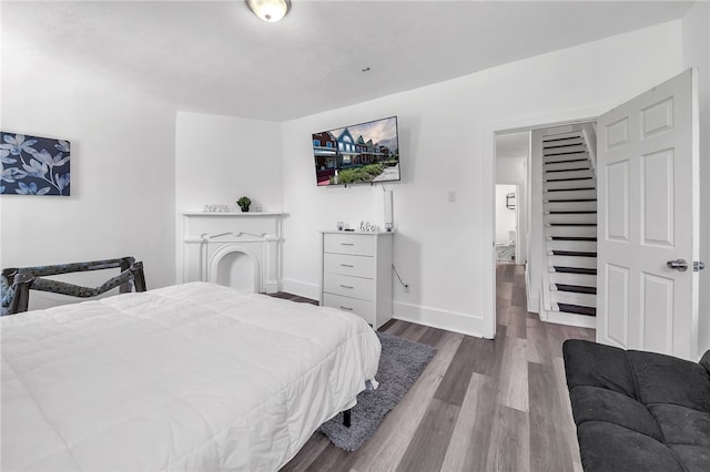 bedroom with hardwood / wood-style floors