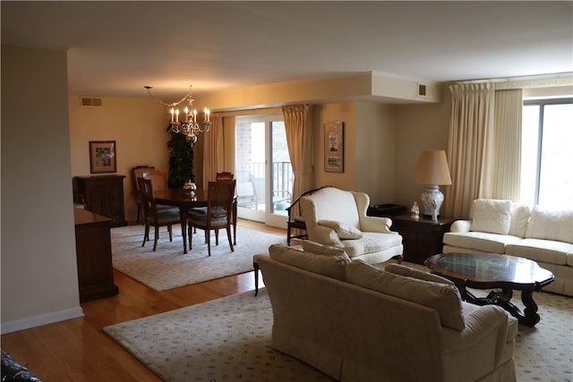 living room featuring hardwood / wood-style floors and a chandelier