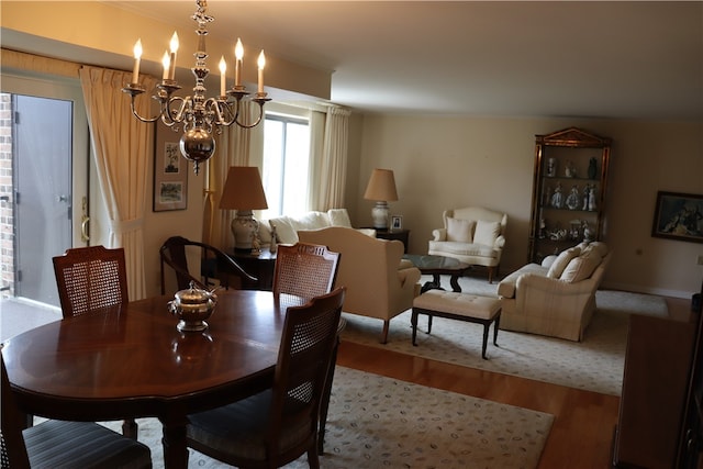 dining area with a chandelier and wood-type flooring