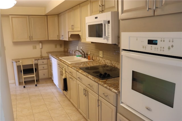 kitchen with white appliances, sink, light stone counters, light tile patterned floors, and decorative backsplash