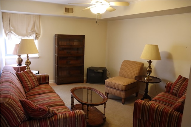 living room with light carpet and ceiling fan