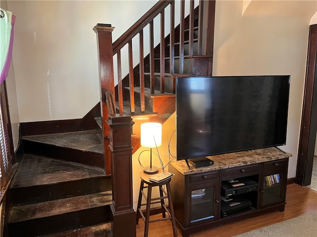 stairway featuring wood-type flooring