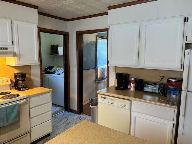 kitchen with fume extractor, white appliances, light hardwood / wood-style floors, washer and clothes dryer, and white cabinets