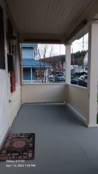 view of patio featuring a balcony