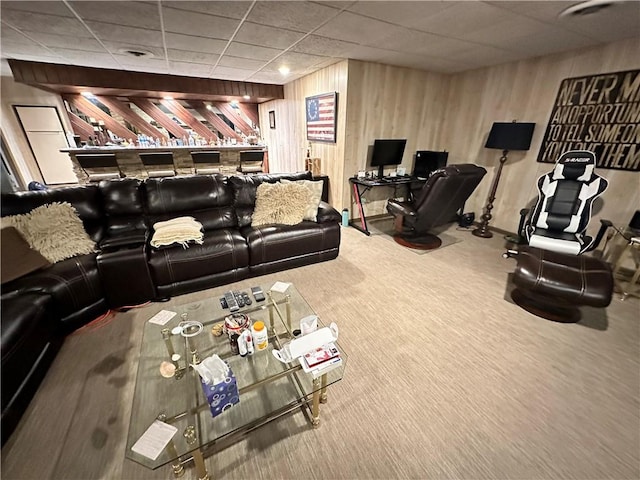 living room featuring a paneled ceiling