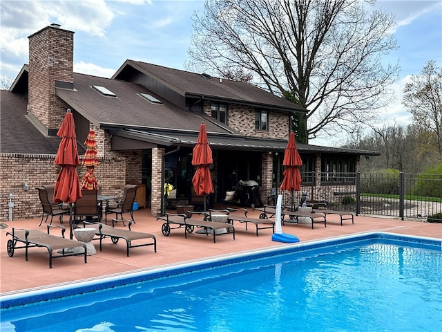 view of pool featuring a patio