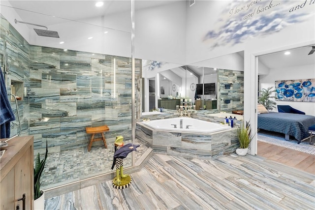 bathroom featuring separate shower and tub and wood-type flooring