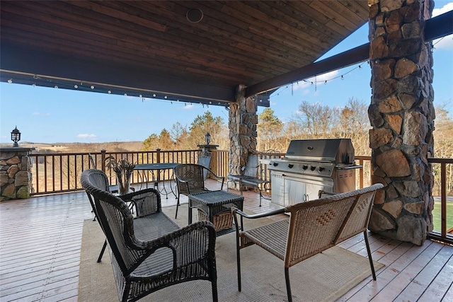 wooden terrace with area for grilling and grilling area