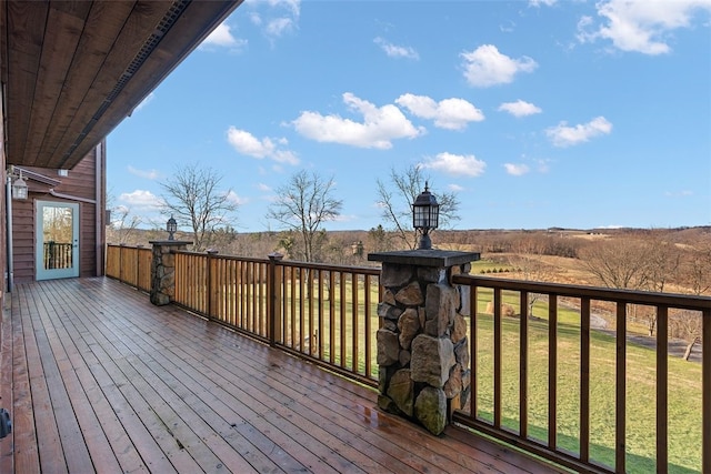 wooden terrace with a yard