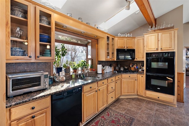 kitchen with lofted ceiling with beams, black appliances, sink, tasteful backsplash, and dark tile flooring